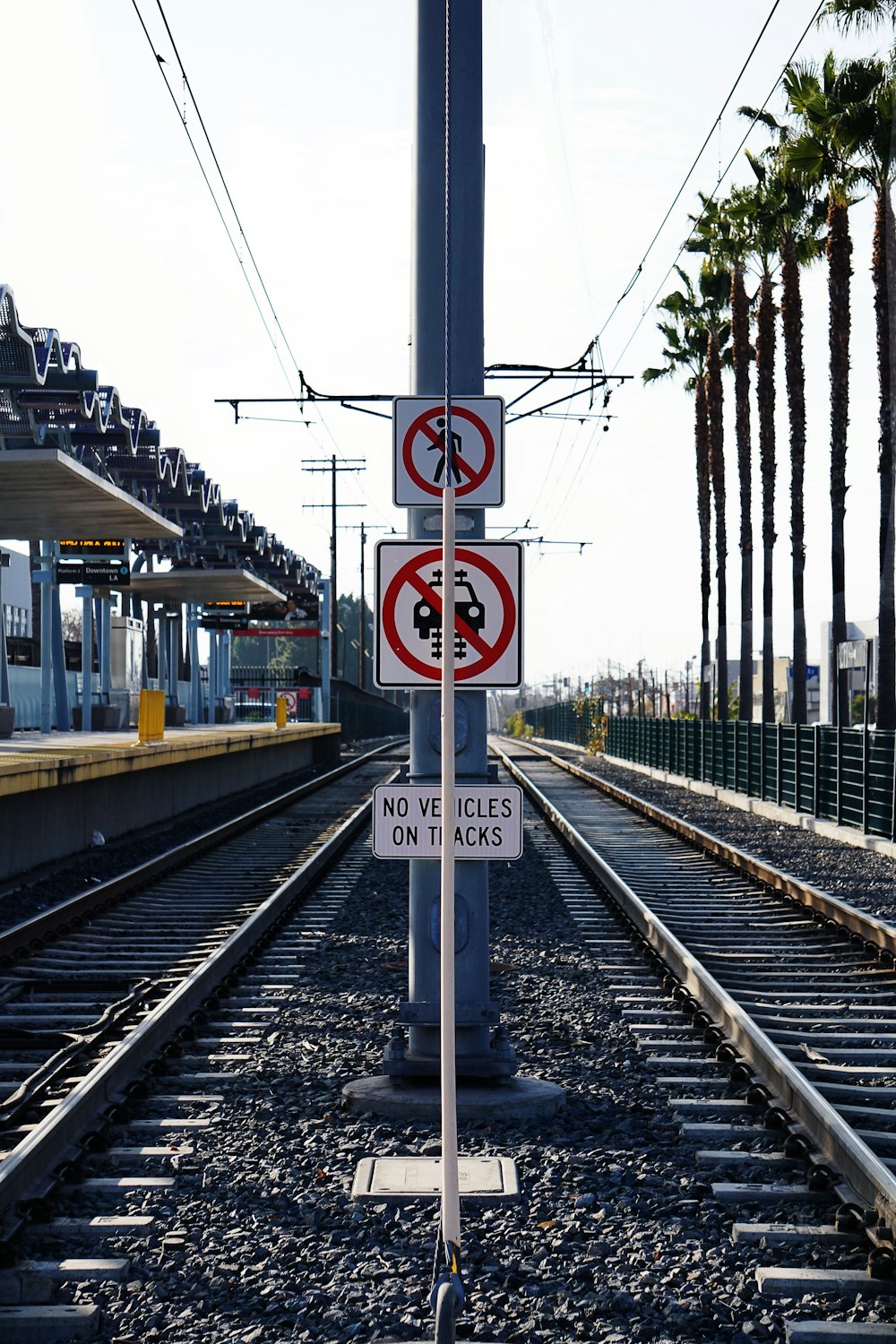 yellow train on rail tracks during daytime