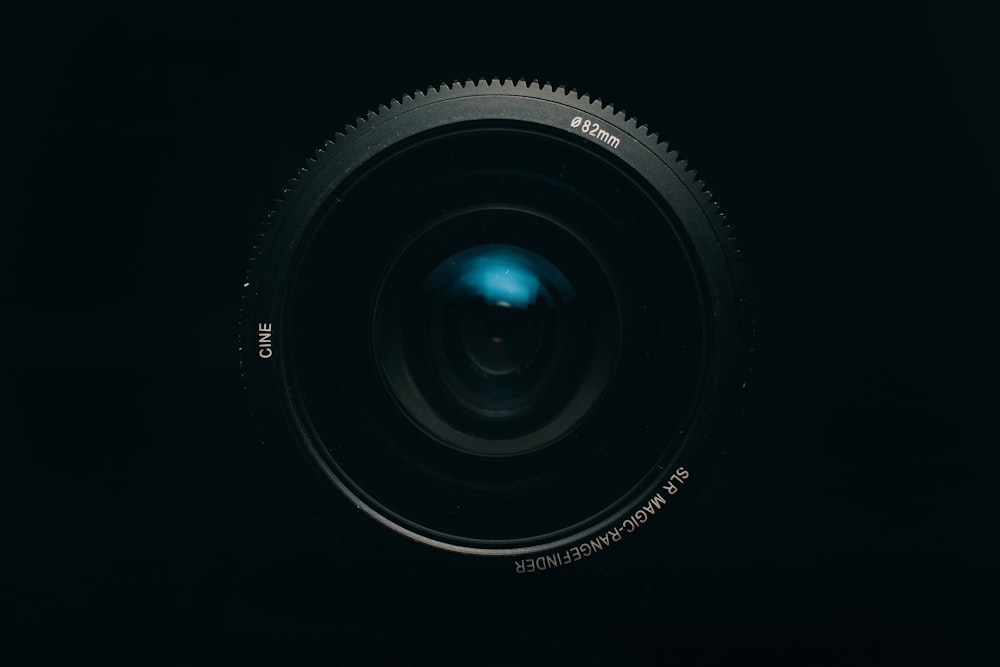 black camera lens on white background