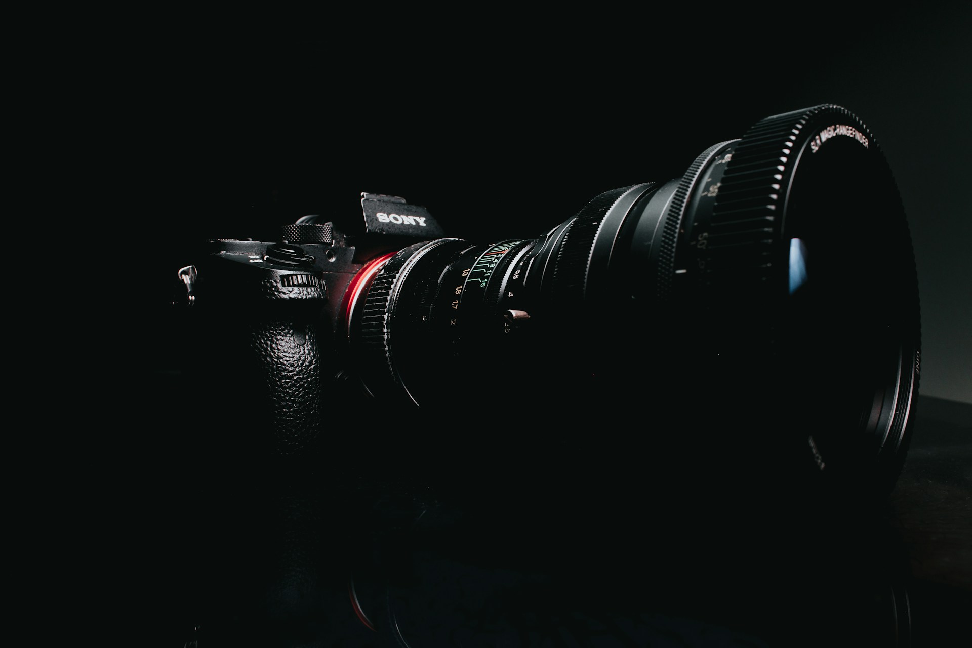 black sony camera on black surface