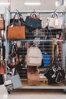white leather shoulder bag on shopping cart