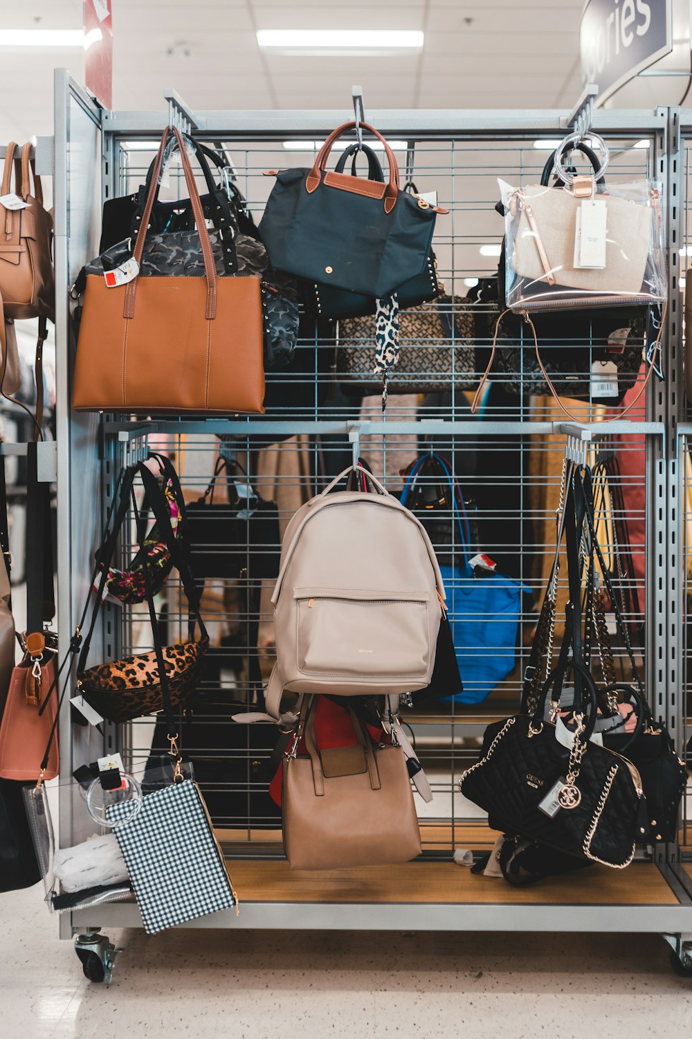 white leather shoulder bag on shopping cart