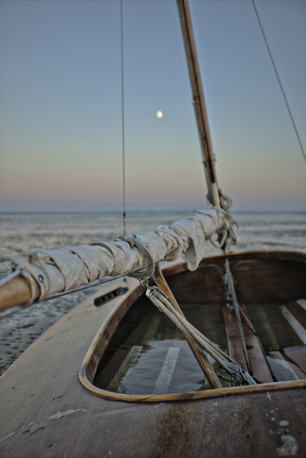 brown wooden boat on sea during daytime