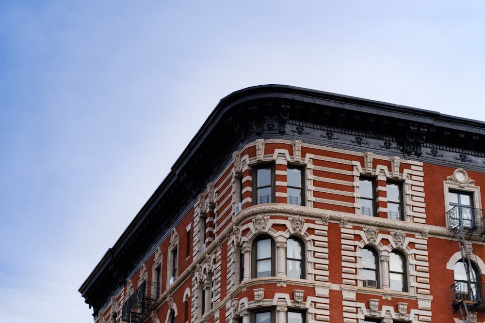 red and white concrete building under blue sky during daytime