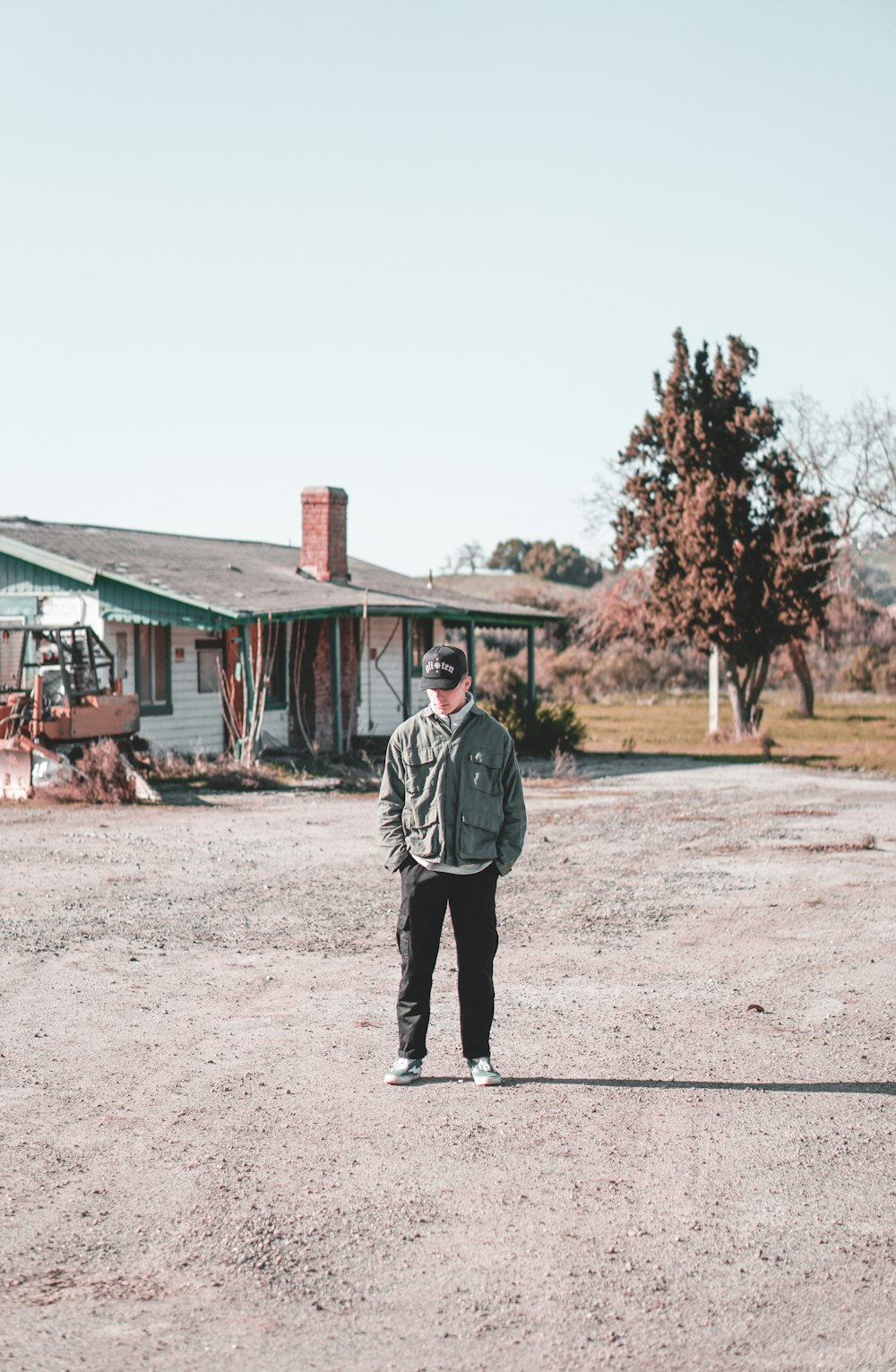 man in black jacket walking on street during daytime