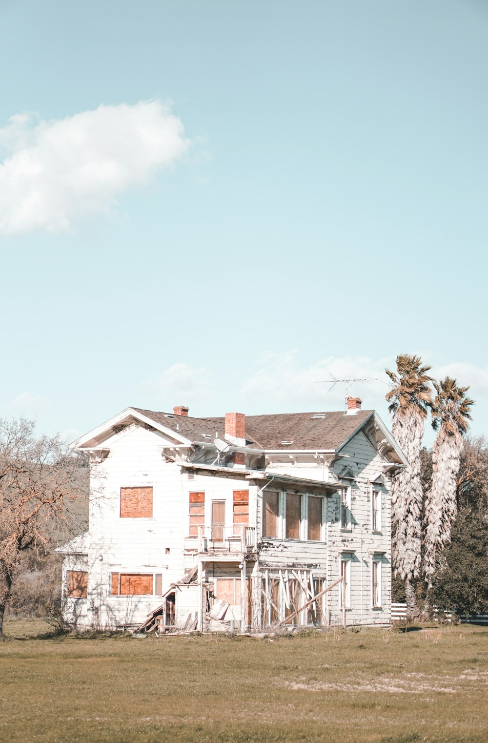 white and brown concrete houses under blue sky during daytime