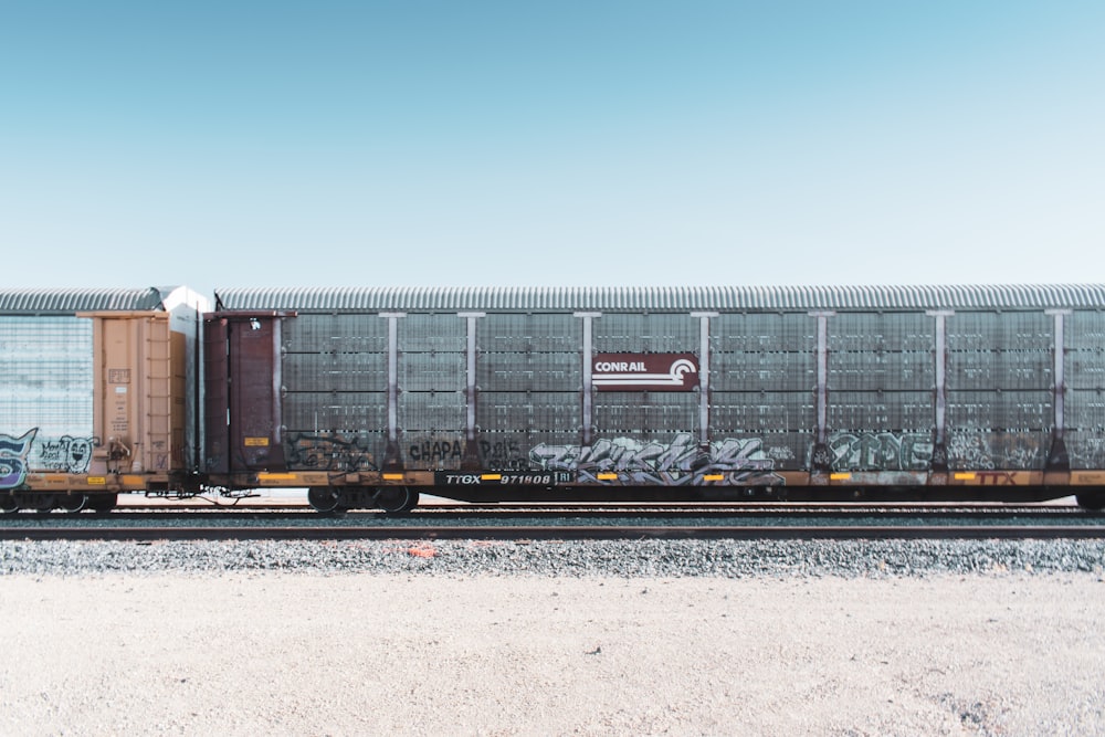 white and brown steel cargo trailer