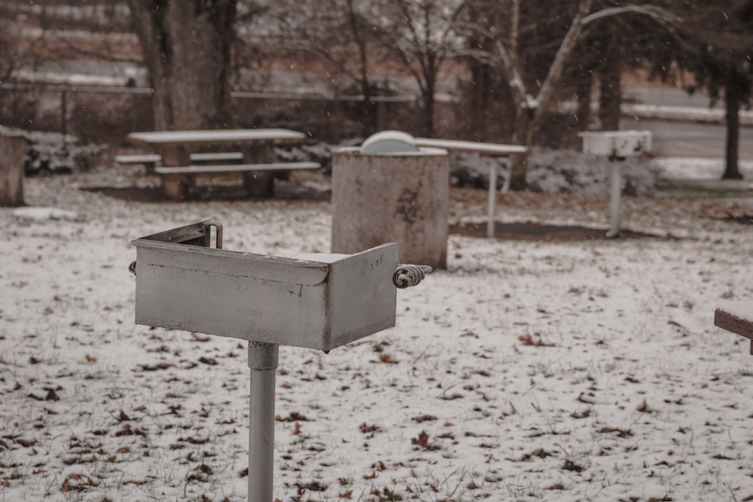 brown wooden box on white snow covered ground during daytime