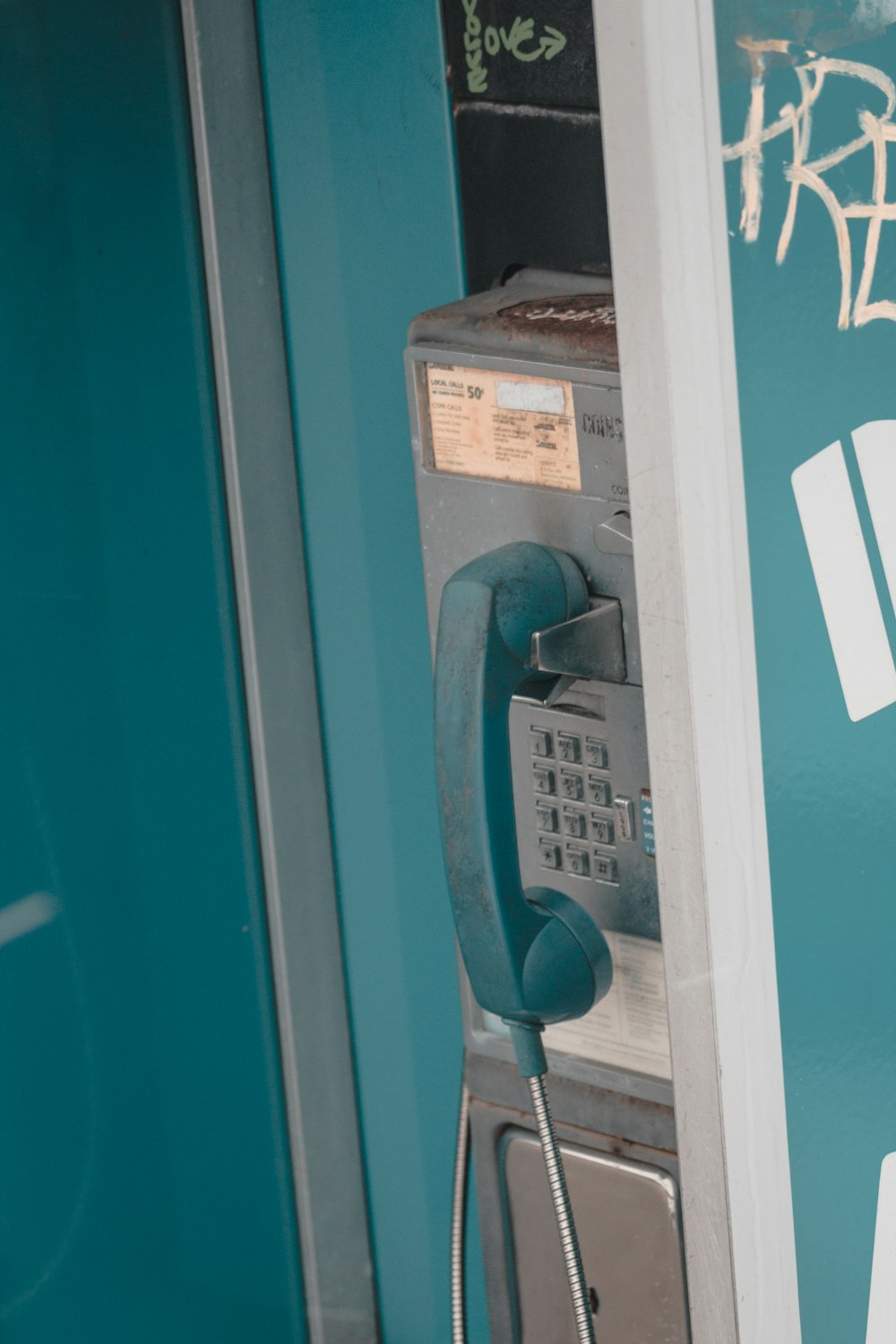 blue and silver telephone booth