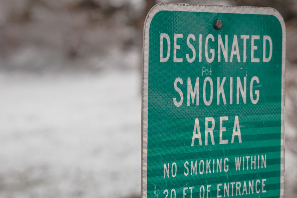 green and white wooden signage