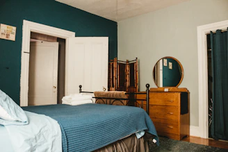 white bed linen on bed