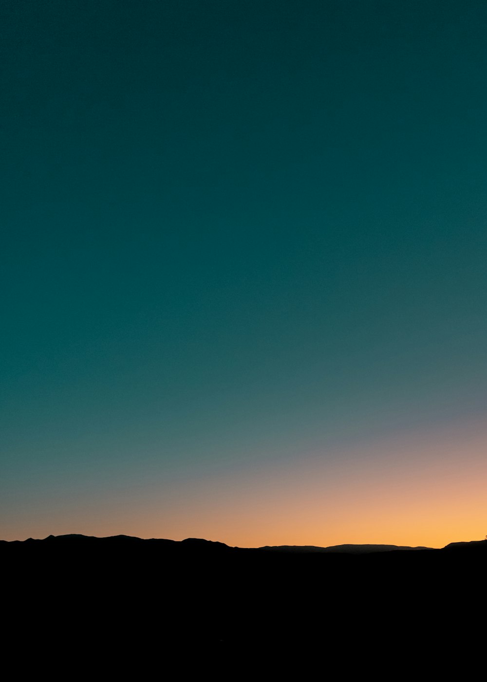 silhouette of mountain during sunset