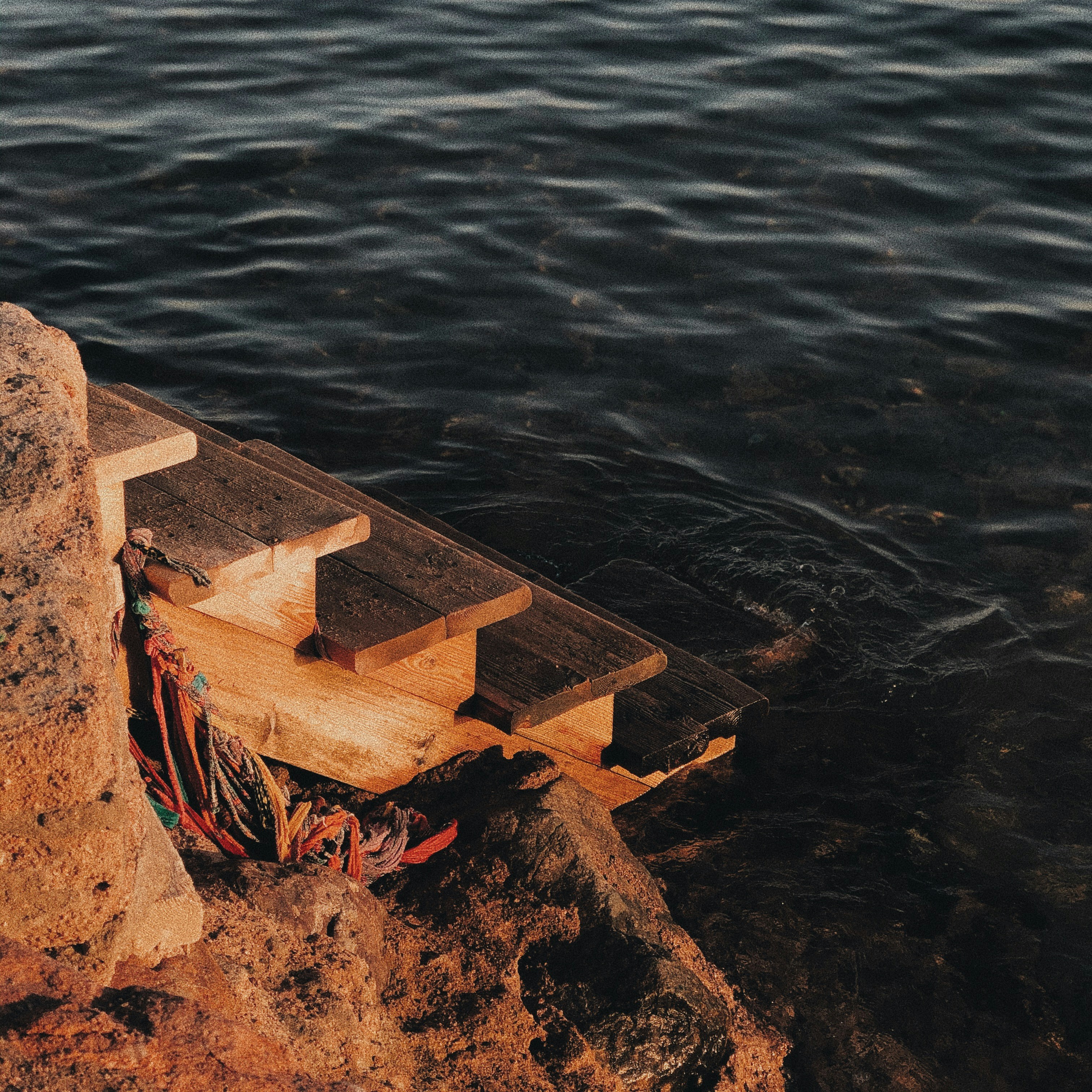 brown wooden dock on body of water during daytime