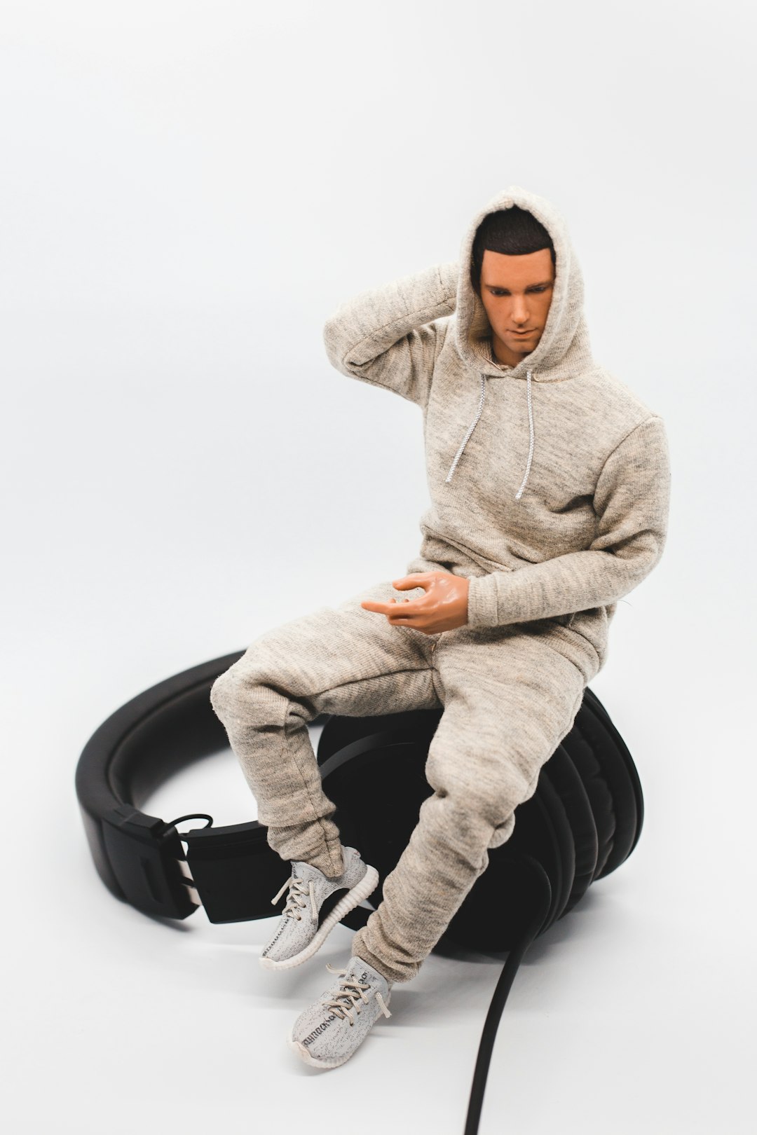 man in gray hoodie and gray pants sitting on black wheel chair