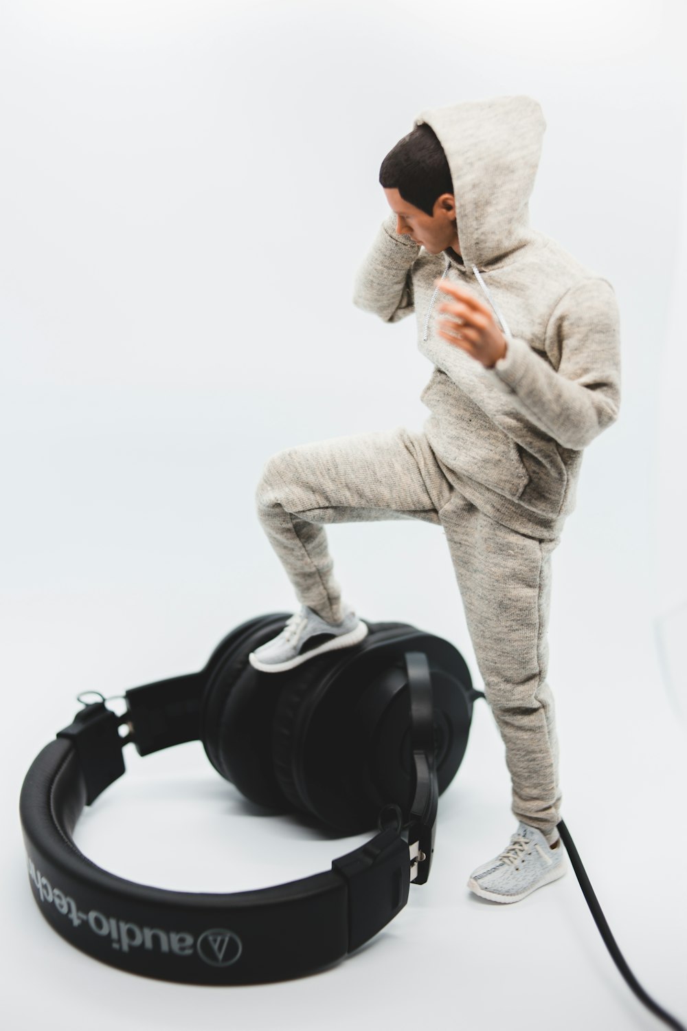 man in gray hoodie and black headphones