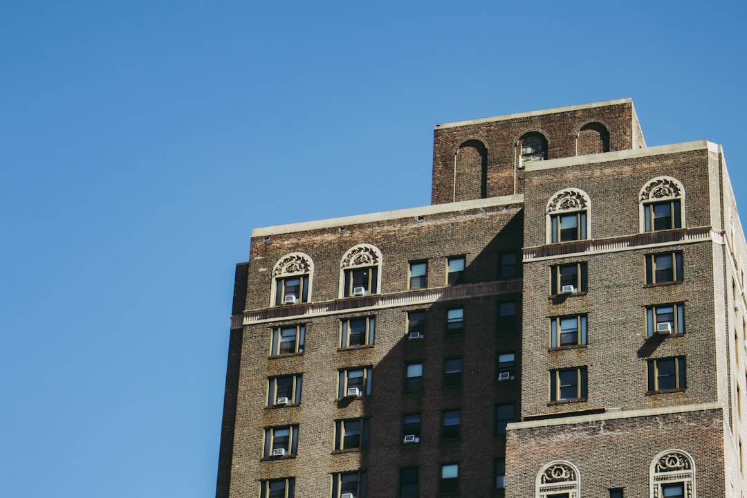 brown concrete building under blue sky during daytime