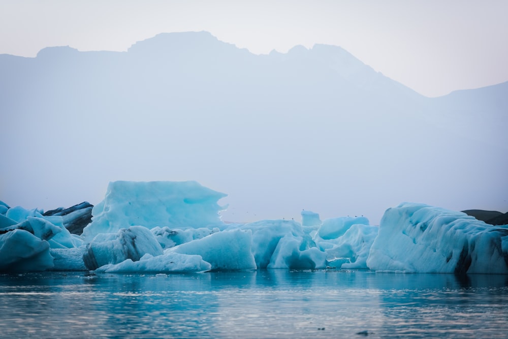 white ice on body of water during daytime