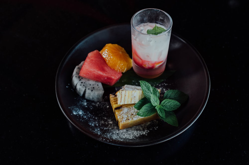 sliced of cake on black round plate