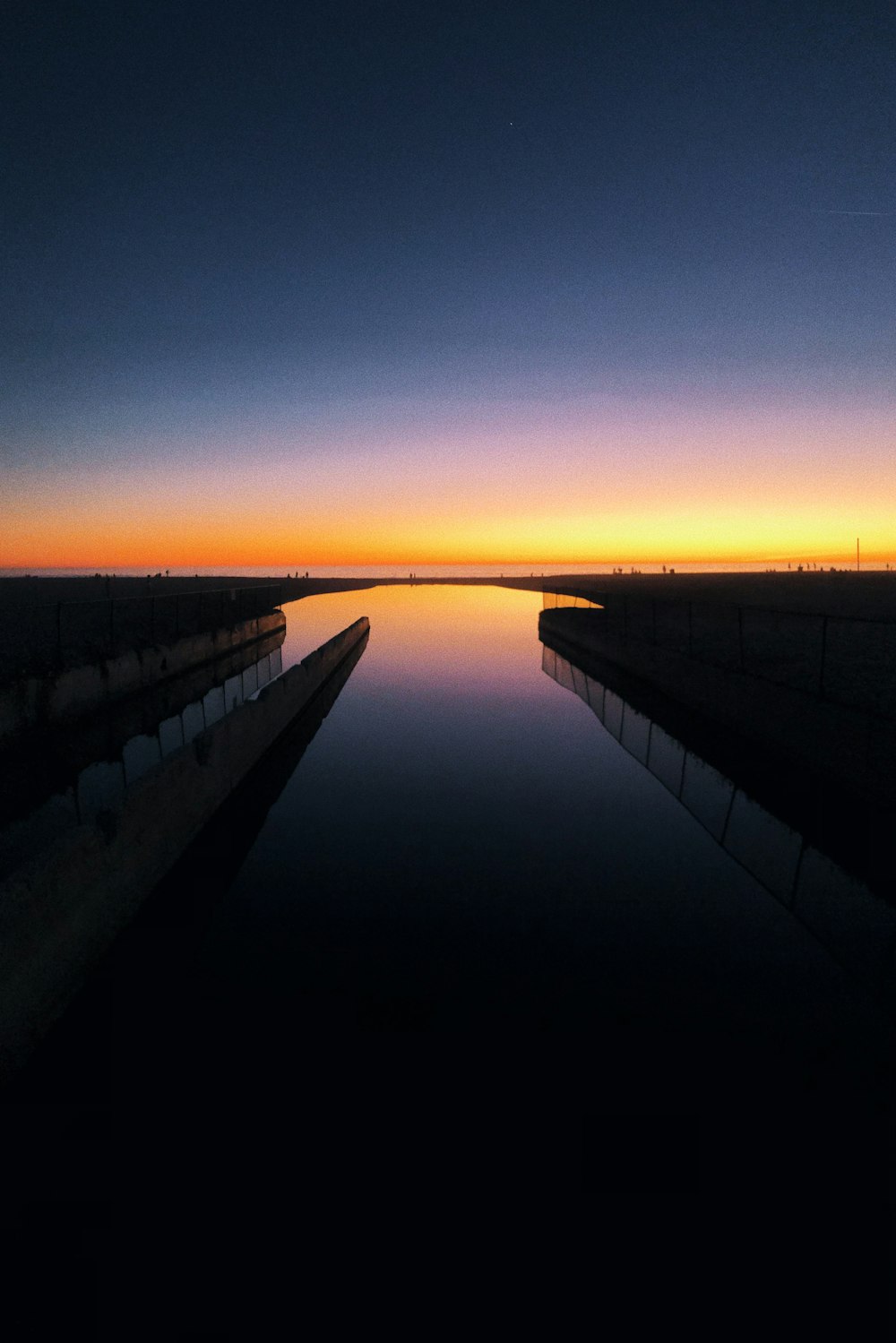 black and white train rail during sunset