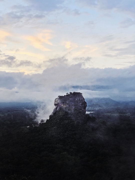 green mountain under white clouds during daytime in Sigiriya Sri Lanka