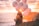 woman in brown jacket holding balloons on beach during sunset
