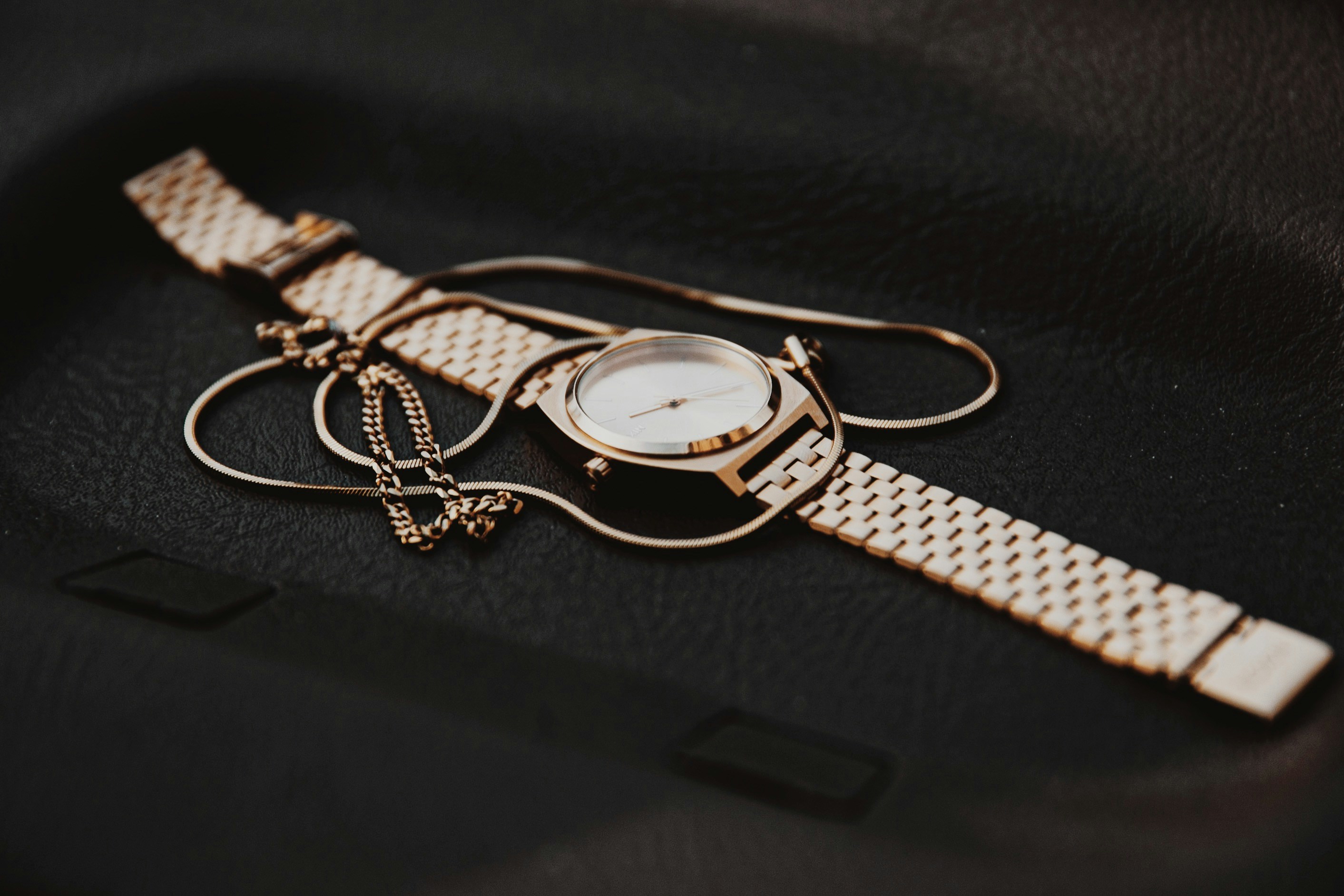silver and gold round analog watch