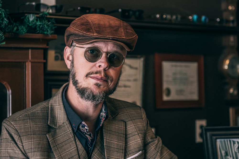 man in brown hat and black sunglasses