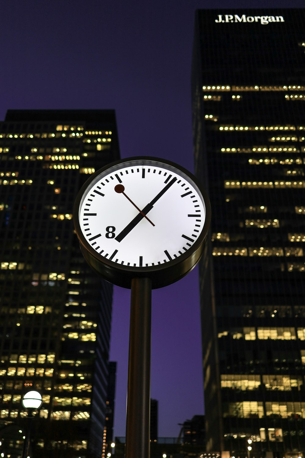 black and white analog clock at 10 00