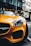 yellow porsche 911 parked on street during daytime