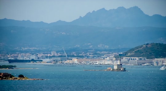 city buildings near body of water during daytime in Olbia Italy