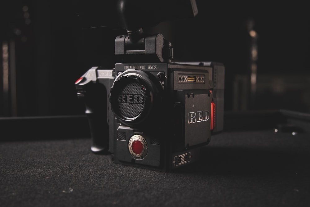 black and red nikon dslr camera