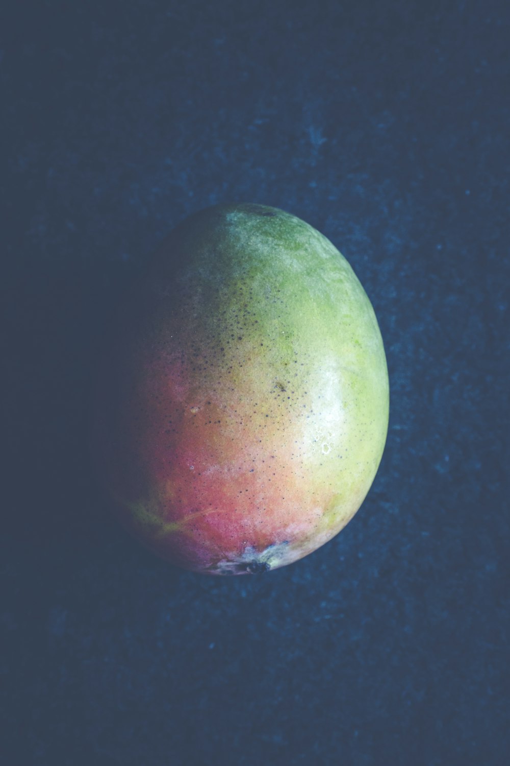 green and red round fruit