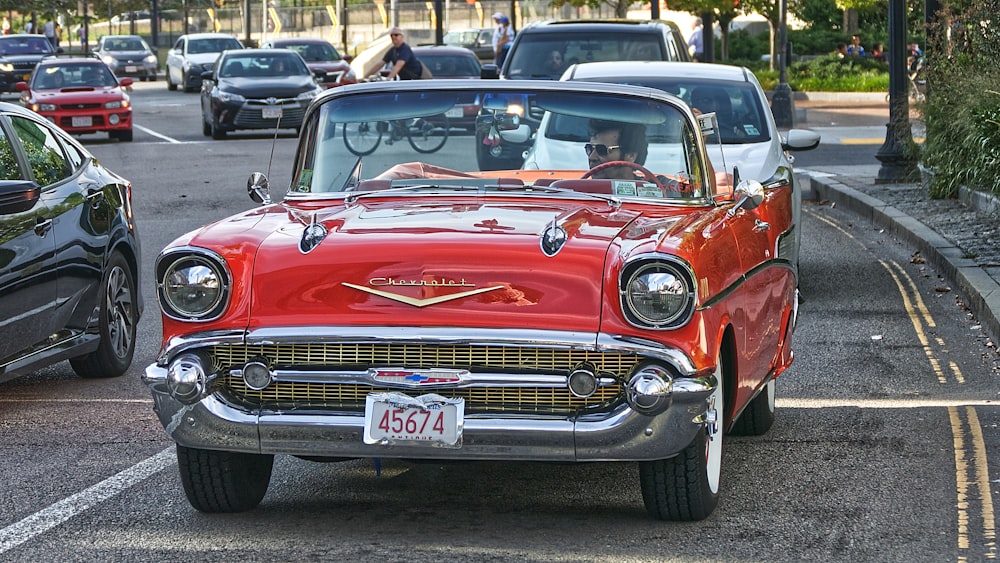 red chevrolet car on road during daytime
