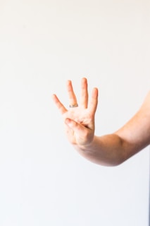 persons left hand with white background