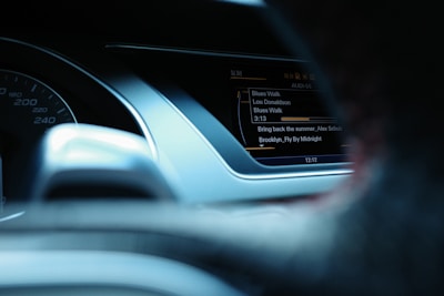 Image of a car interior showing a music streaming interface.