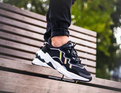 person in black and white nike sneakers