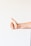 persons right hand doing thumbs up
