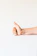 persons right hand doing thumbs up
