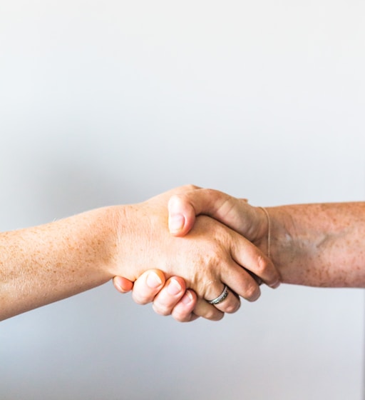 person holding hands of another person