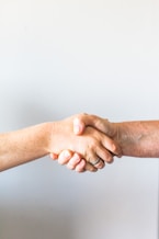 person holding hands of another person