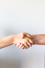 person holding hands of another person