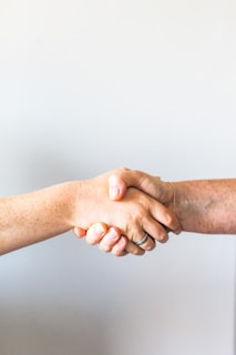 person holding hands of another person