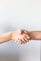 person holding hands of another person