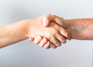 person holding hands of another person