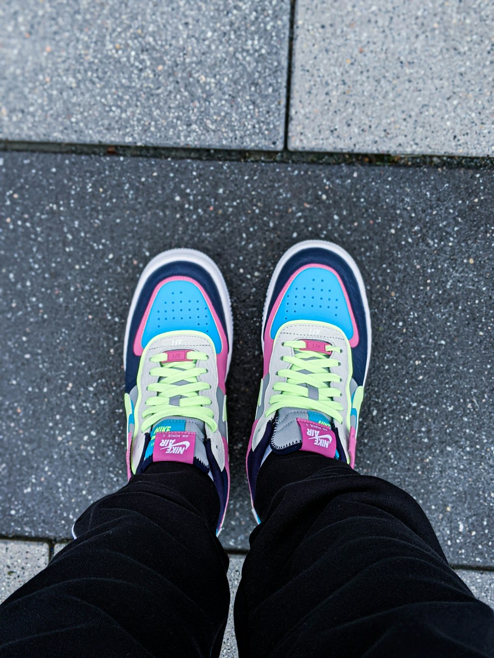 person wearing blue and white sneakers