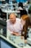 A smiling professional consultant discussing digital strategies with a client in a modern office.