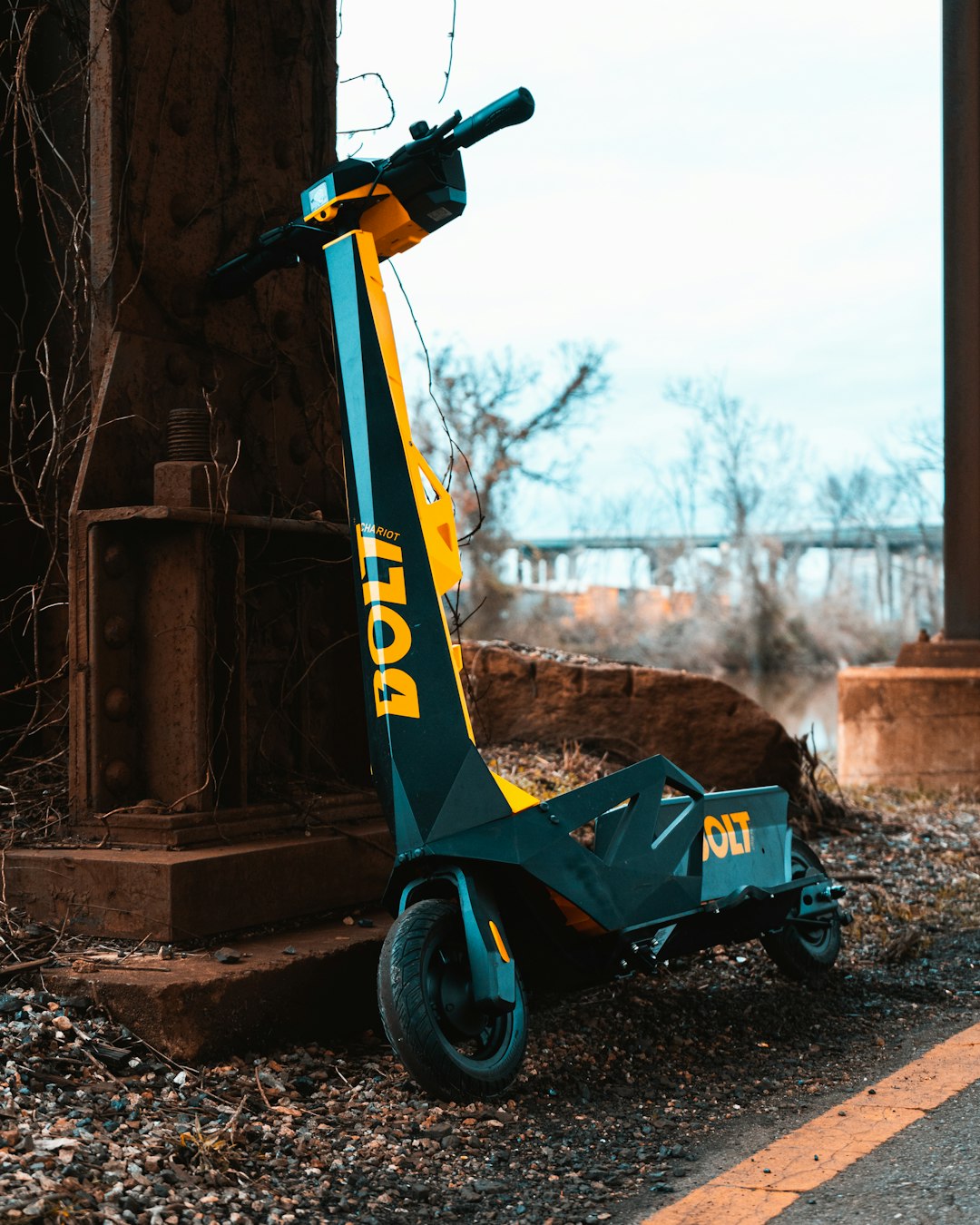 blue and yellow scooter on brown soil