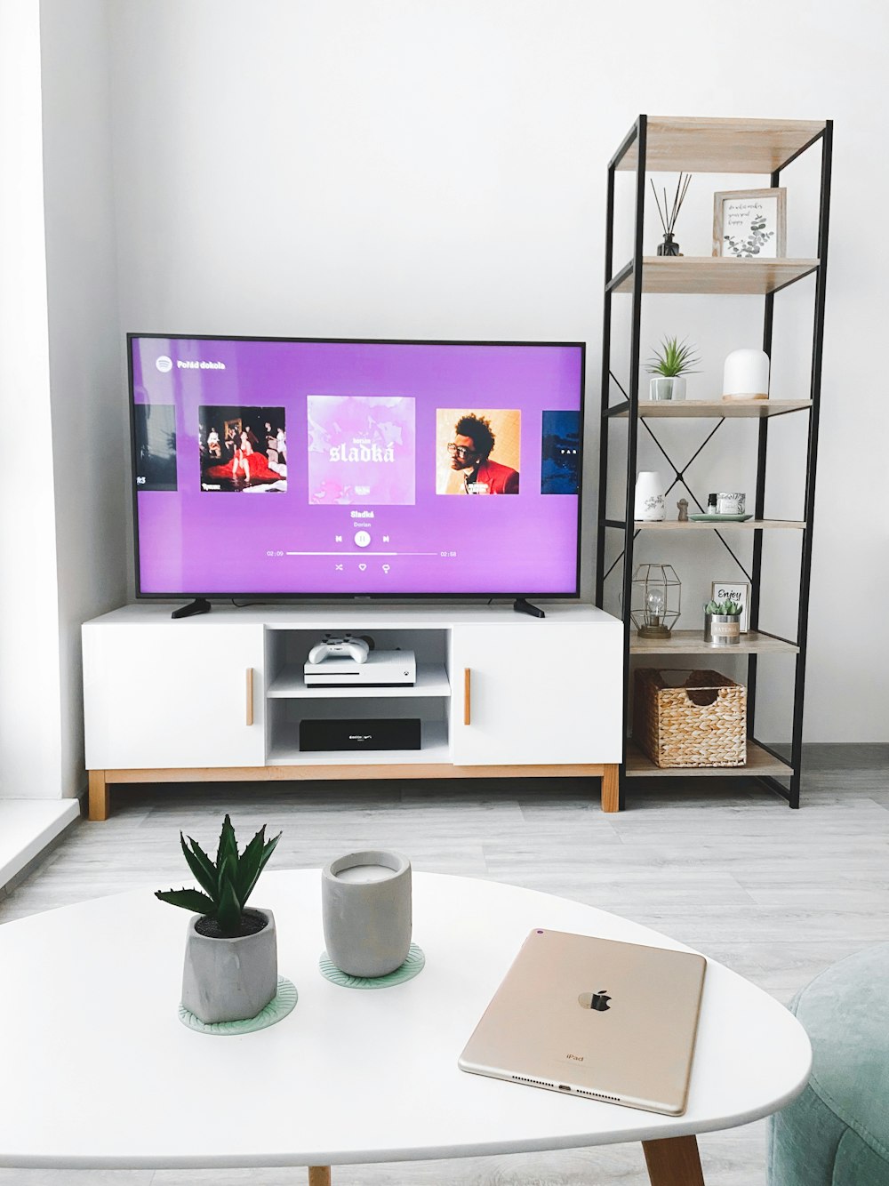 black flat screen tv turned on displaying man in black suit