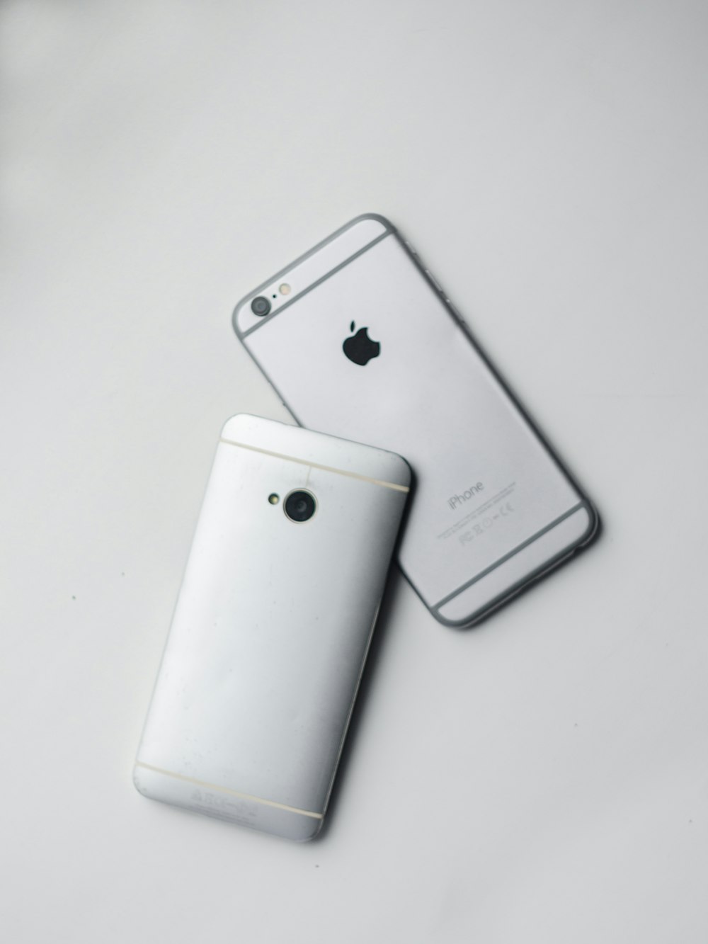 silver iphone 6 on white table