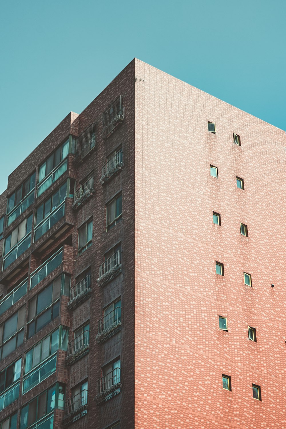 pink concrete building under blue sky during daytime