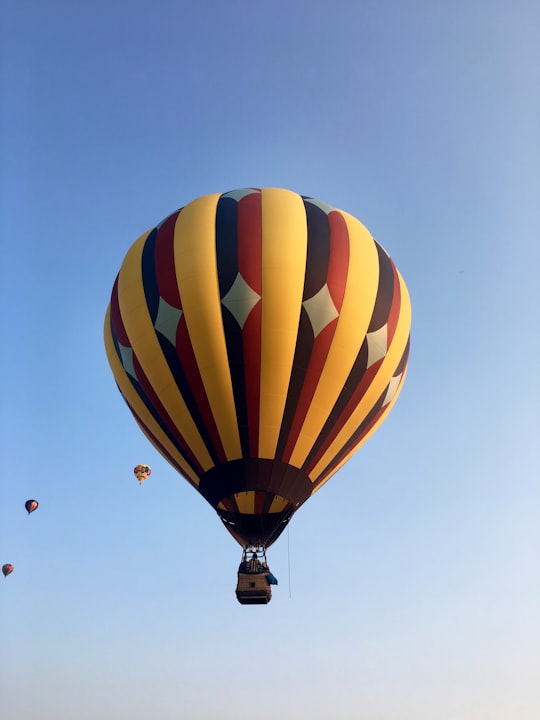 blue yellow and green hot air balloon in Boise United States